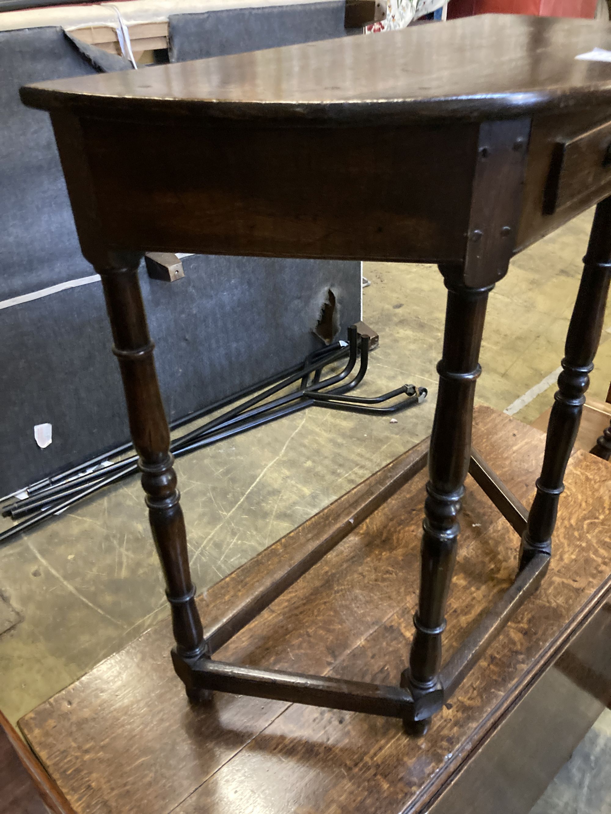 A 18th century style D shaped oak side table, width 68cm, depth 35cm, height 76cm